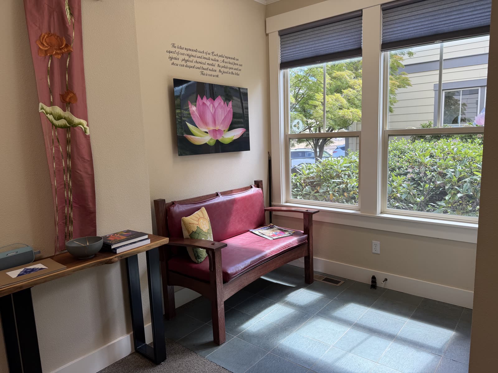A quiet reading nook with the lotus print at Thriving Family Chiropractic